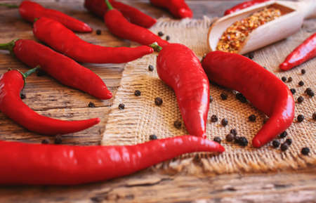 hot chili peppers on wooden background. selective focusの写真素材