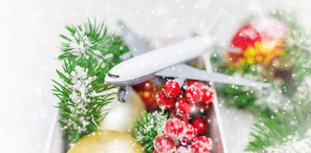 Travel for Christmas. Airplane with Christmas decor. Selective focus.Holidayの写真素材