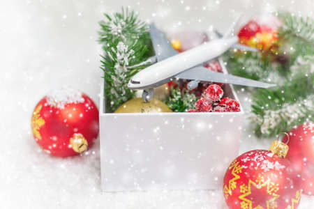 Travel for Christmas. Airplane with Christmas decor. Selective focus.Holidayの写真素材