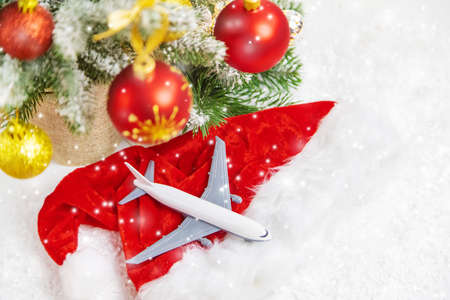Travel for Christmas. Airplane with Christmas decor. Selective focus.の写真素材