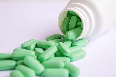 Vitamin tablets used as a dietary supplement.green tablets..selective focus.medicalの写真素材
