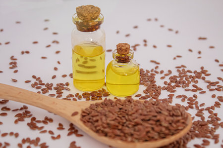 Bowl of brown flax seed and linseed oil. selective focus.の写真素材