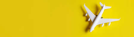 Airplane model. airplane on yellow background. selective focus.holidayの写真素材