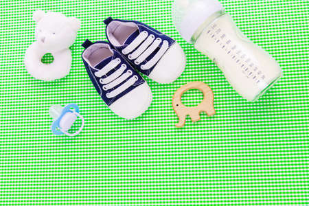 Baby accessories and food on a green background. Selective focus.babyの写真素材