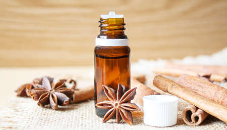 Star anise and cinnamon oil in a bottle. Selective focus. natureの写真素材