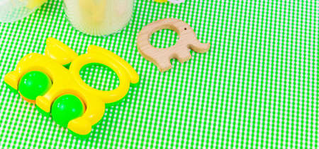Baby accessories and food on a green background. Selective focus.nature