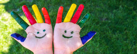 Children's hands in the colors of summer. Selective focus.natureの写真素材