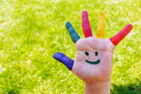 Children's hands in the colors of summer. Selective focus.natureの写真素材