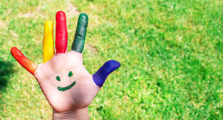 Children's hands in the colors of summer. Selective focus.natureの写真素材