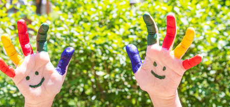 Children's hands in the colors of summer. Selective focus.natureの写真素材