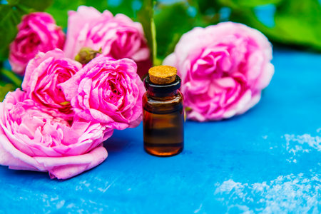 tea rose oil in a small bottle. selective focus.natureの写真素材