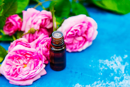 tea rose oil in a small bottle. selective focus.natureの写真素材
