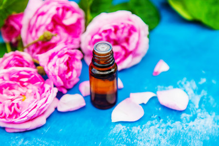 tea rose oil in a small bottle. selective focus.natureの写真素材