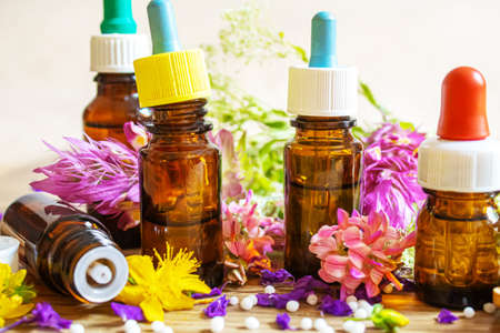 medicinal herbs, oils in small bottles homeopathy. selective focus.の写真素材