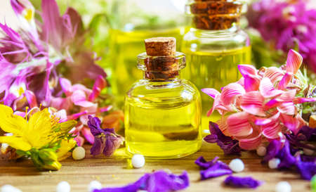medicinal herbs, oils in small bottles homeopathy. selective focus.の写真素材