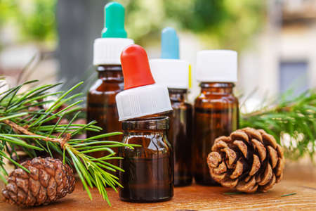 Fir tree essential oil in small bottles. Selective focus.natureの写真素材