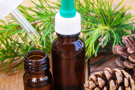 Fir tree essential oil in small bottles. Selective focus.natureの写真素材