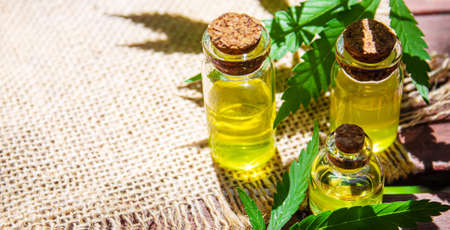 Cannabis extract essential oil in a small bottle. Selective focus. Nature.の写真素材