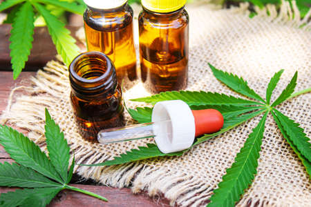 Cannabis extract essential oil in a small bottle. Selective focus. Nature.の写真素材