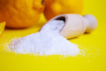 Citric acid on a yellow background. Selective focus.natureの写真素材