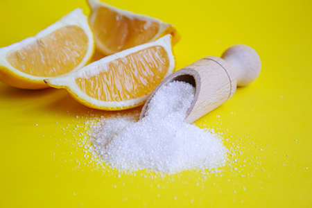 Citric acid on a yellow background. Selective focus.natureの写真素材