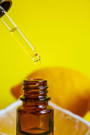 lemon essential oil on a yellow background. Selective focus.natureの写真素材