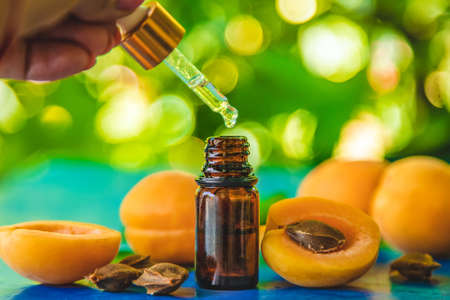 Apricot kernel oil in a bottle. Selective focus. Nature.の写真素材