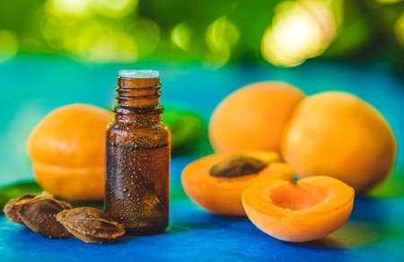 Apricot kernel oil in a bottle. Selective focus.の写真素材