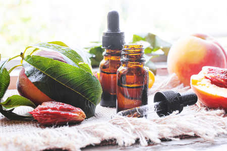 Peach seed oil in a bottle. Selective focus.foodの写真素材