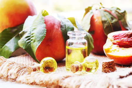 Peach seed oil in a bottle. Selective focus.foodの写真素材