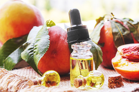 Peach seed oil in a bottle. Selective focus.foodの写真素材