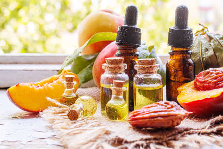 Peach seed oil in a bottle. Selective focus.foodの写真素材