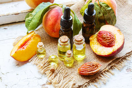 Peach seed oil in a bottle. Selective focus.foodの写真素材