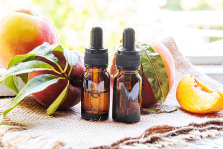Peach seed oil in a bottle. Selective focus.foodの写真素材