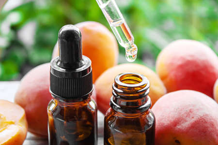 Apricot kernel oil in a bottle. Selective focus.nature
