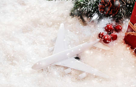 Travel for Christmas. Airplane with Christmas decor.New year.Selective focus.holidaysの写真素材