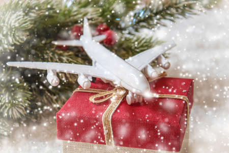 Travel for Christmas. Airplane with Christmas decor.New year.Selective focus.holidaysの写真素材