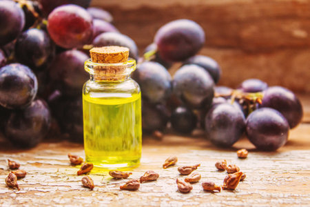 Extract of grape oil in a small jar. Selective focus. food.natureの写真素材