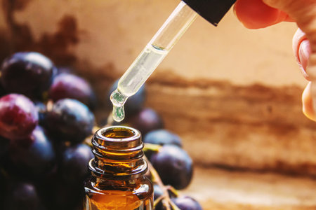 Extract of grape oil in a small jar. Selective focus. food.natureの写真素材