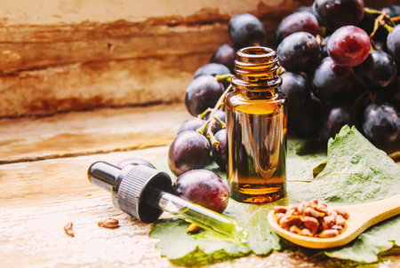 Extract of grape oil in a small jar. Selective focus. food.natureの写真素材