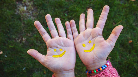 children hands in colors. Summer photo. Selective focus. natureの写真素材
