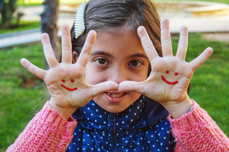 children hands in colors. Summer photo. Selective focus. natureの写真素材