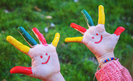 children hands in colors. Summer photo. Selective focus. natureの写真素材