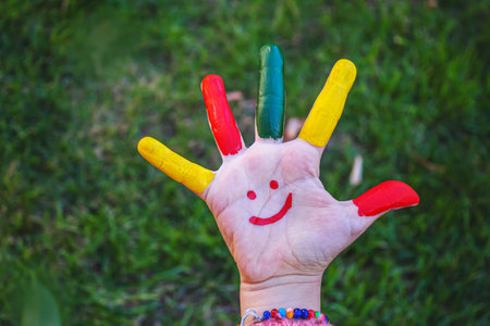 children hands in colors. Summer photo. Selective focus. natureの写真素材