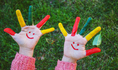 children hands in colors. Summer photo. Selective focus. natureの写真素材