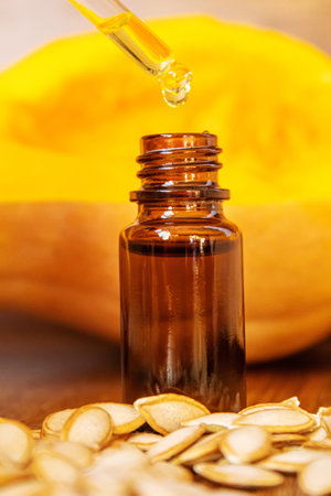 Pumpkin seed oil in a bottle. Selective focus. Nature.の写真素材
