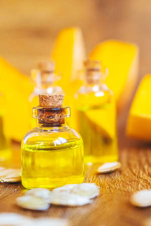 Pumpkin seed oil in a bottle. Selective focus. Nature.の写真素材