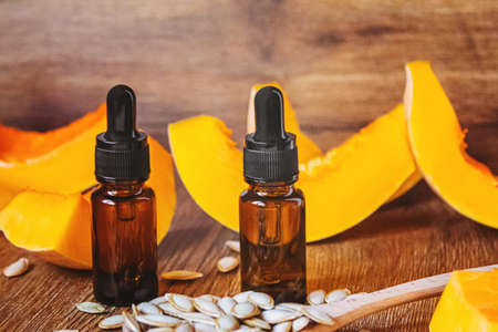 Pumpkin seed oil in a bottle. Selective focus. Nature.の写真素材