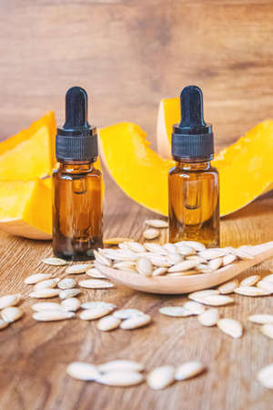 Pumpkin seed oil in a bottle. Selective focus. Nature.の写真素材