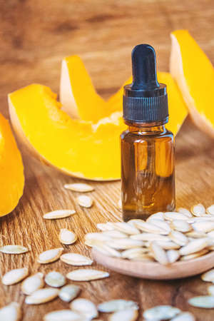Pumpkin seed oil in a bottle. Selective focus. Nature.の写真素材